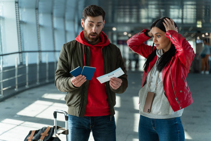 Couple seeing passport at airport